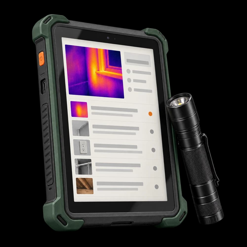 Inspection tablet displaying findings beside a flashlight